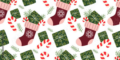 Cozy Christmas stocking pattern with festive socks filled with gifts, candy canes, and green wrapped presents. Seamless holiday design in cozy flat style, perfect for winter wrapping paper, packaging.