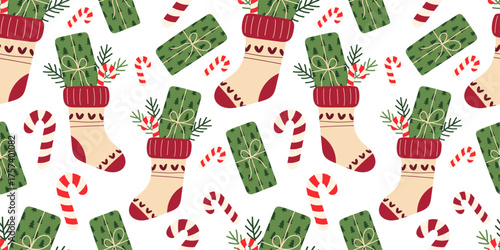 Holiday stocking seamless pattern  with decorative socks filled with gifts, candy canes, and pine branches. Cozy winter design in flat hand-drawn style, ideal for wrapping paper, textile prints.