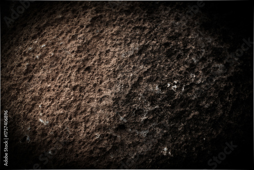 dark background black and white photo stone texture, rough wall suitable for background design, wallpaper