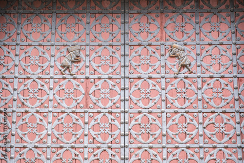 Ornate pink white wall with geometric and floral patterns