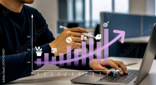 Financial Growth and Investment Concept Boost Your Income, Wages, and Portfolio Profitability. A Businessman Analyzing Virtual Charts on Laptop Representing Economic Growth Smart Investment Strategy