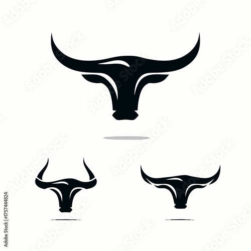 Collection of black bull or ox head silhouettes with prominent horns, symbolizing strength and power. Minimalist vector graphic design.