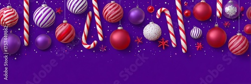 Festive christmas ornaments and candy canes arranged on a purple background