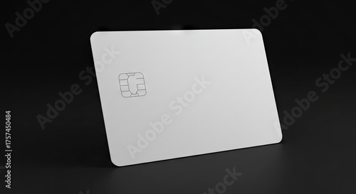 White credit card with chip against a black background