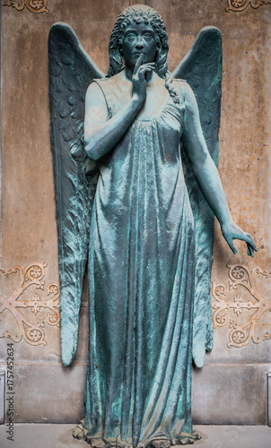 Monument of old angel in Catholic cemetery.