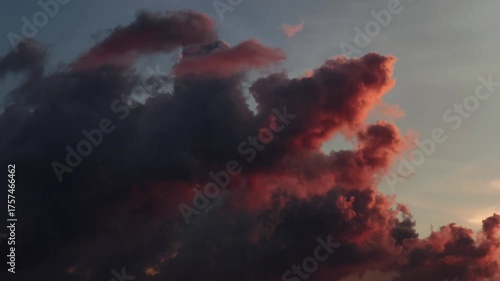 Time-lapse video of dark storm clouds forming and moving across the sky. Dramatic weather background footage suitable for cinematic scenes, forecasts, or mood visuals.