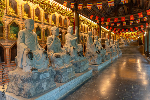 Buddha statues along the corridor lead to Bai Dinh pagoda, one of the largest in the south east Asia in Ninh Binh, Vietnam