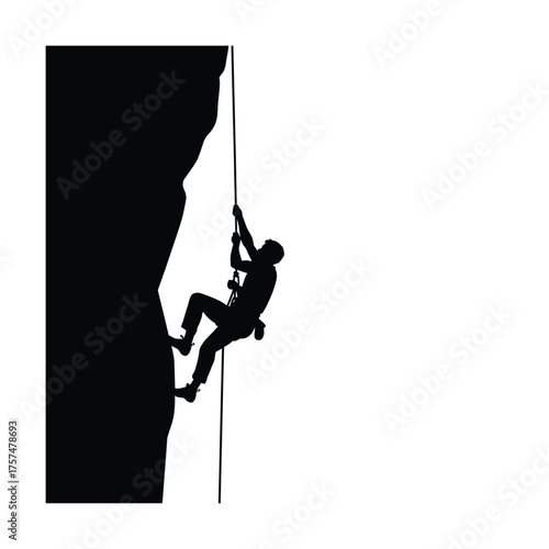 Man climbing a sheer rock face silhouette