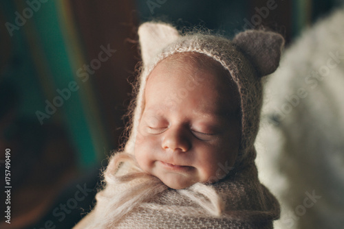 A newborn baby is wrapped in diapers with a wool cap in a basket. Swaddling, maternity hospital, family, ivf, life planning, parenting. A mother's love for her child. Baby food. High quality photo