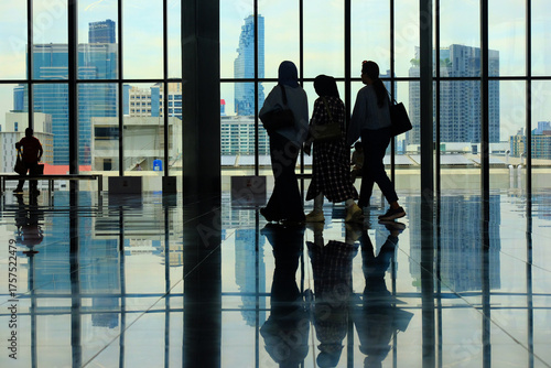 silhouettes of people in airport