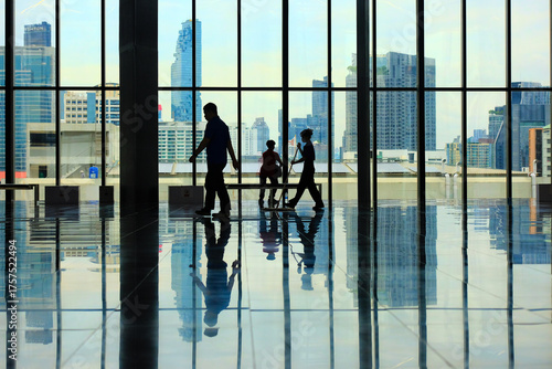 silhouettes of people in airport