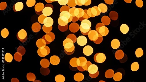 Abstract Golden Bokeh Lights on Black Background for Festive Season.