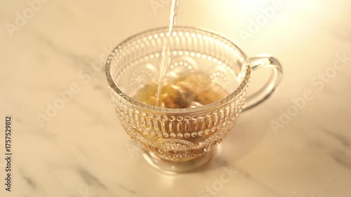 Pouring Hot Water Over Tea Bag in Glass Cup – Tea Brewing Close-Up