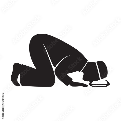 Silhouette of a Muslim man praying on a prayer rug, a symbol of Islamic faith and devotion