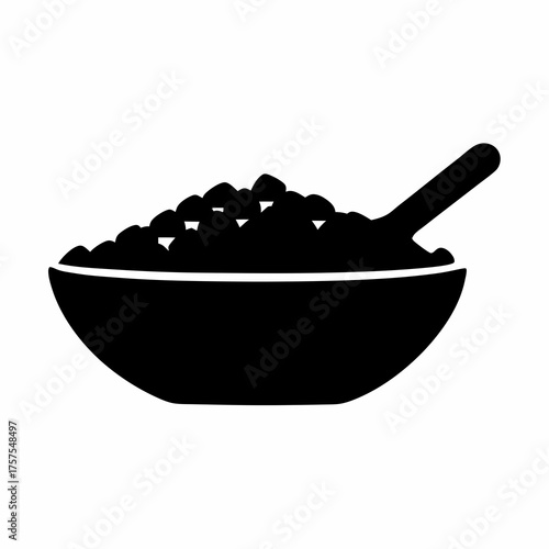 Monochrome image of a bowl filled with food and a serving spoon
