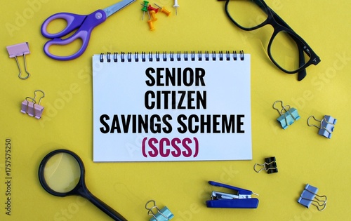 Senior citizen savings scheme concept highlighted through text on notebook with yellow background.