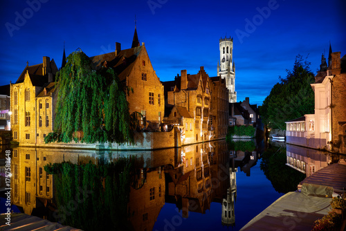 Historic Bruges Rozenhoedkaai Night Reflection. Dusk on the historic Rozenhoedkaai of Bruges, Belgium, with medieval buildings, canal and belfry.

