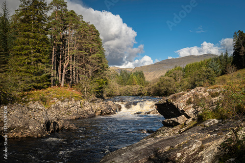 A bright autumnal HDR image of Easan Dubha waterfall cascading through Glen Orchy on its way to Loch Awe, Argyle and Bute, Scotland. 