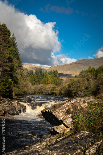 A bright autumnal HDR image of Easan Dubha waterfall cascading through Glen Orchy on its way to Loch Awe, Argyle and Bute, Scotland. 