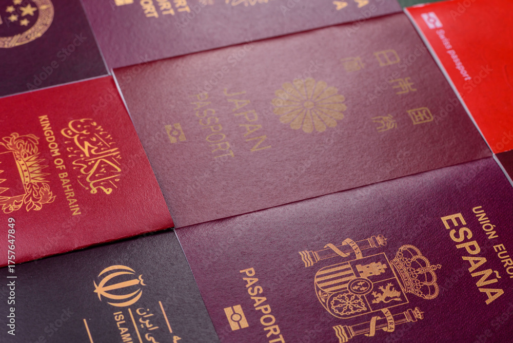 Fototapeta premium A background of several passports from different countries, an international ID card. Passport