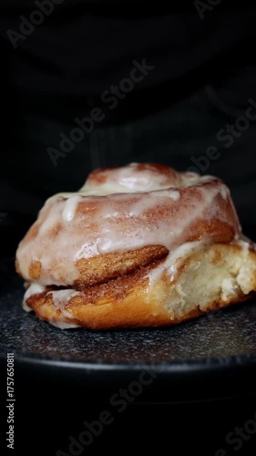 Freshly Baked Cinnamon Roll Rotating on Plate – Homemade Pastry Dessert