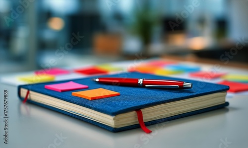 Creative Workspace Featuring a Notebook and Colorful Sticky Notes During Daytime