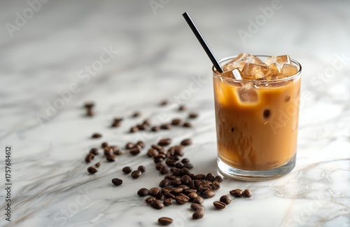 Chilled Coffee Drink With Ice on a Marble Countertop Surrounded by Coffee Beans