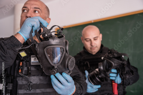 Tactical medics preparing gas masks for riot control training