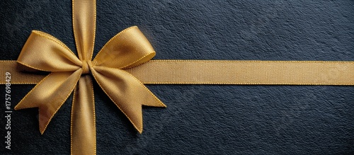 Elegant Golden Ribbon on a Dark Surface Ready for Special Occasion Gift Wrapping