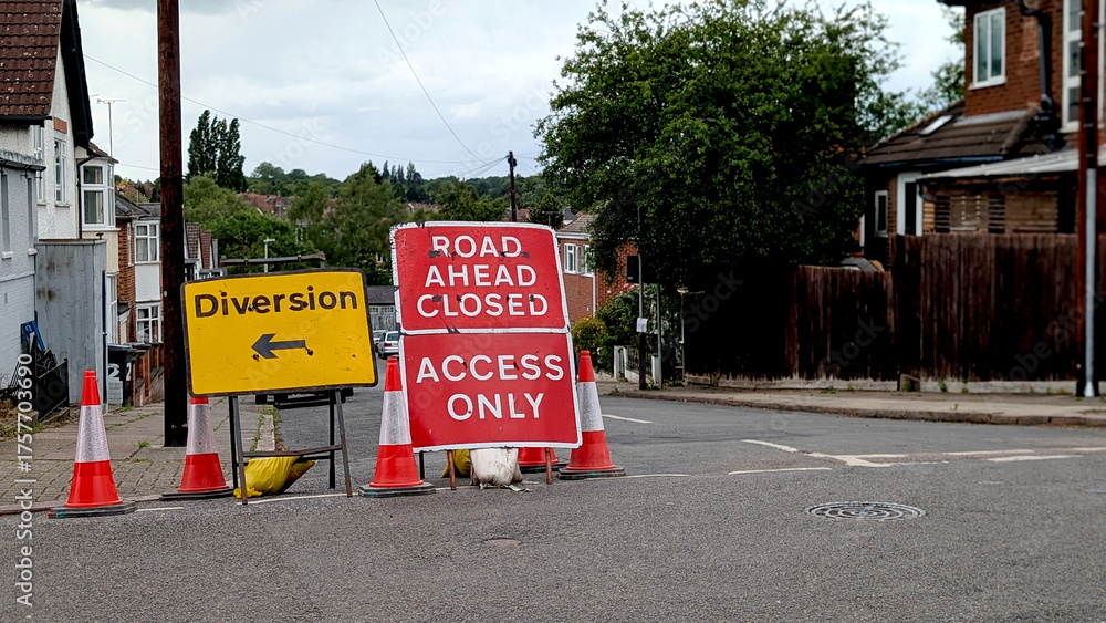 © Adrenaloby - Multiple road signs including Diversion and Road Ahead Closed Access Only with traffic cones on an urban street corner for themes of roadworks, planning or public inconvenience © Adrenaloby - Multiple road signs including Diversion and Road Ahead Closed Access Only with traffic cones on an urban street corner for themes of roadworks, planning or public inconvenience