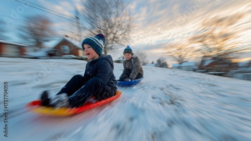 Children Enjoying a Snowy Sledding Adventure During Sunset in a Residential Area