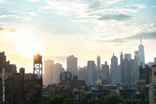 View of financial district Manhattan skyline and Brooklyn buildings at sunset