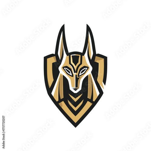 Abstract gold and black jackal head within a shield emblem, inspired by ancient Egyptian mythology, suitable for a gaming mascot.