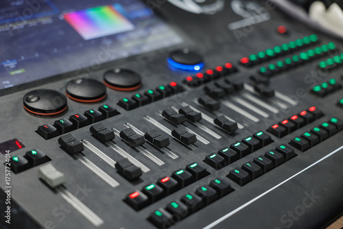 Professional Audio Mixing Console Close-Up with Faders, Knobs and LED Meters