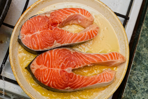 Seasoned Salmon Fillets Ready For Grilling On Rustic Skillet