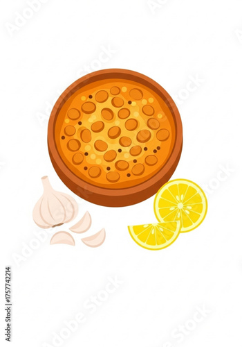 Lentil dal dish served in a bowl with garlic and lemon slices  