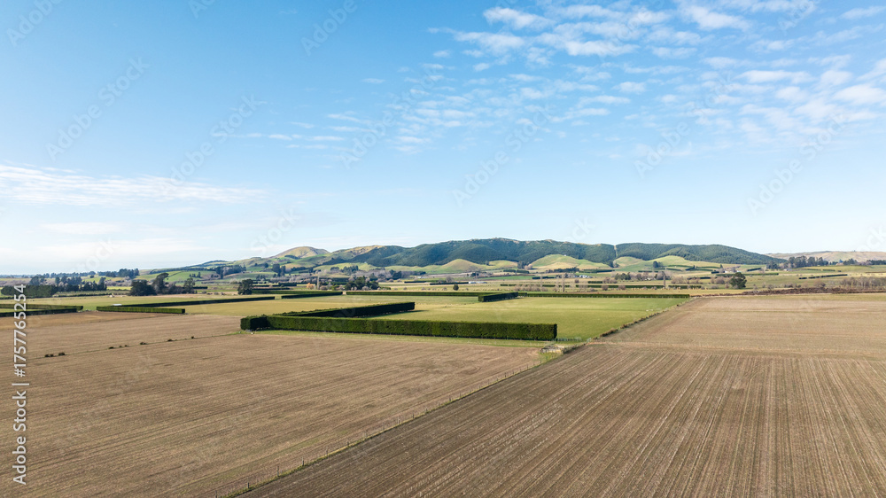 Obraz premium Drone perspective of vast area agriculture and farm land in the heartland of the South Island NZ