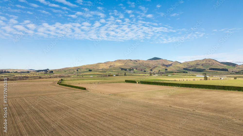 Obraz premium Drone perspective of vast area agriculture and farm land in the heartland of the South Island NZ