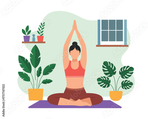 Woman practicing yoga indoors with plants and window