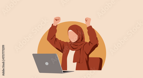 An empowered young woman wearing a hijab joyfully achieves her professional goals, celebrating a significant accomplishment at her computer.
