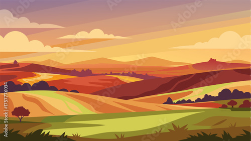 A panoramic view of the prairie with layers of hills and fields drenched in the warm colors of a setting sun.