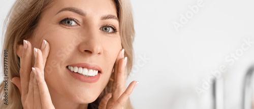 Beautiful woman doing face ...