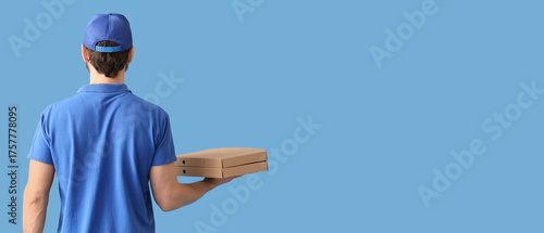 Male courier with pizza box...