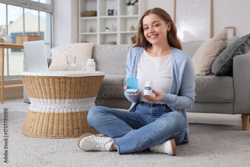 Young woman with vitamin B ...