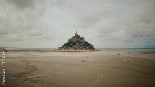 Aerial Drone View of Mont Saint Michel and Surrounding Sea on a Summer Day