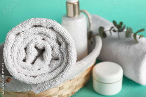 Rolled white towel and spa ...