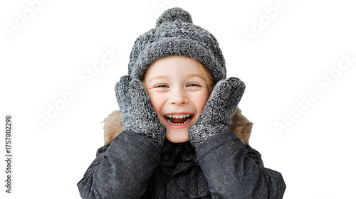 a small child in winter clothes laughs and smiles