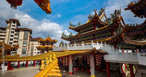 Kuala Lumpur, Malaysia – October 13, 2025: Time lapse of Thean Hou Temple courtyard decorated with hundreds of lanterns, visitors walking and clouds moving above