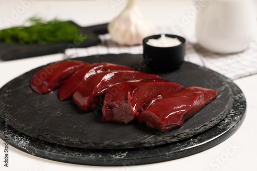 Boards with raw liver and b...