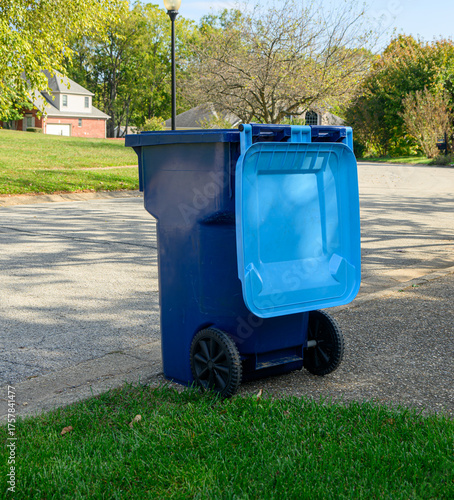 Residential Trash Bin sitting in driveway